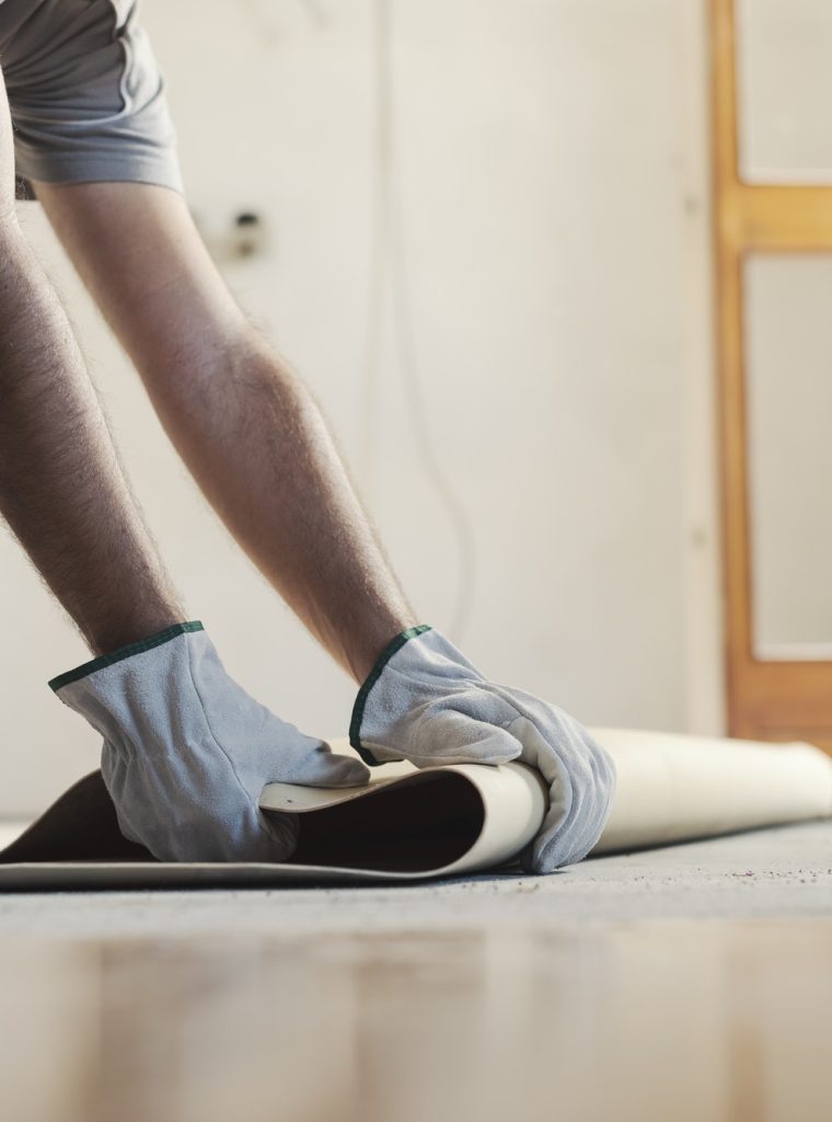contractor-removing-an-old-linoleum-flooring-2.jpg